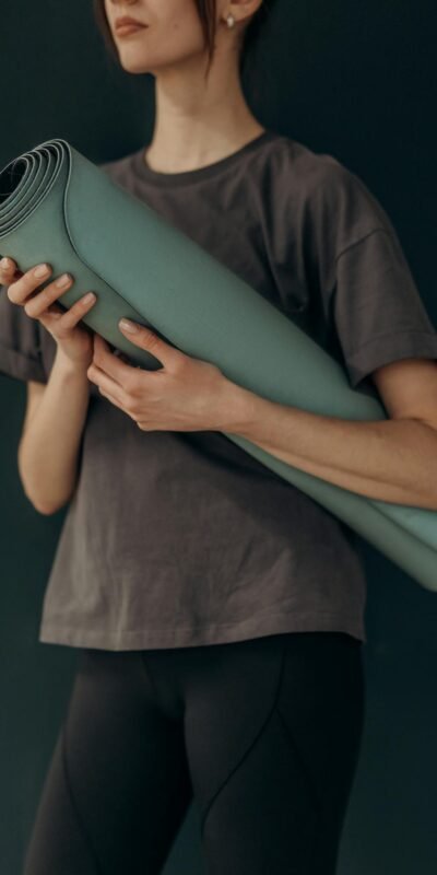 Crop Photo Of Woman With Yoga Mat